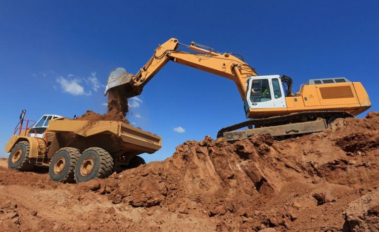Excavator Loading Soil On The Truck — East Point Earthmoving In Byron Bay, NSW